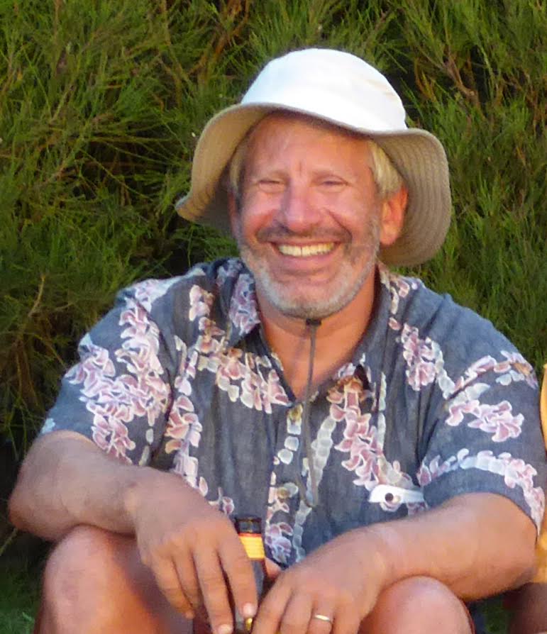 head shot image, seated, sunhat